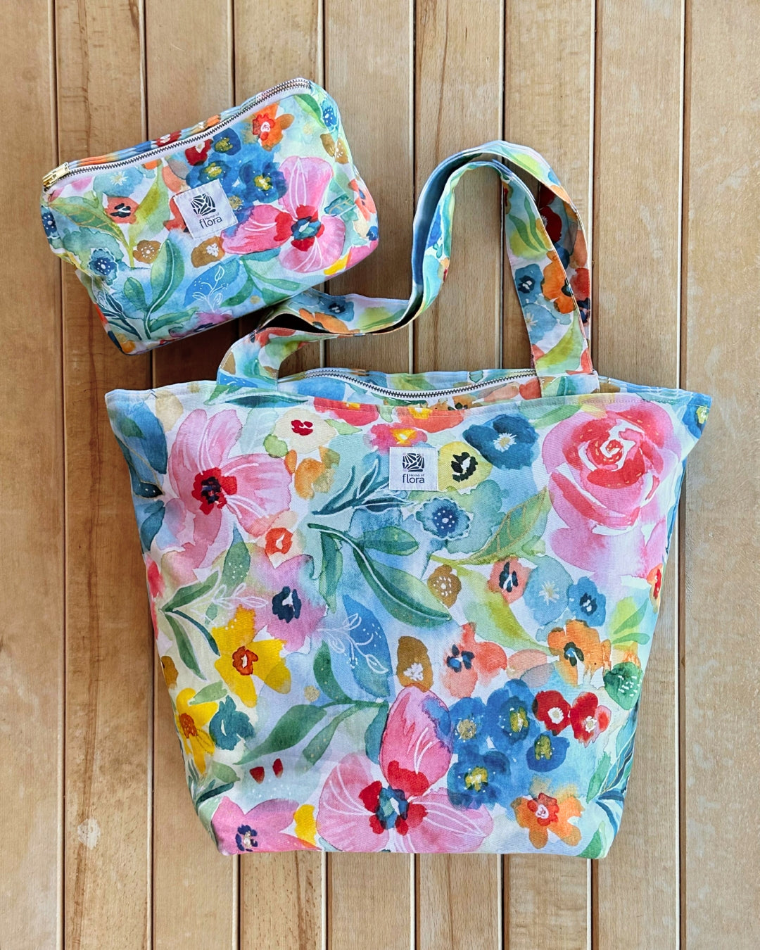 Floral-patterned tote bag and pouch on a wooden surface