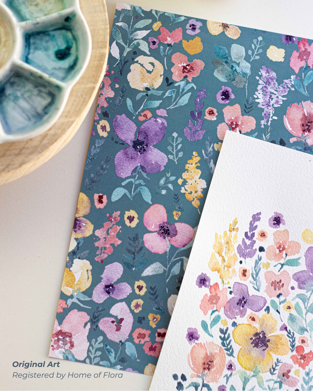 Floral patterned paper and card with watercolor paint palette on a white background