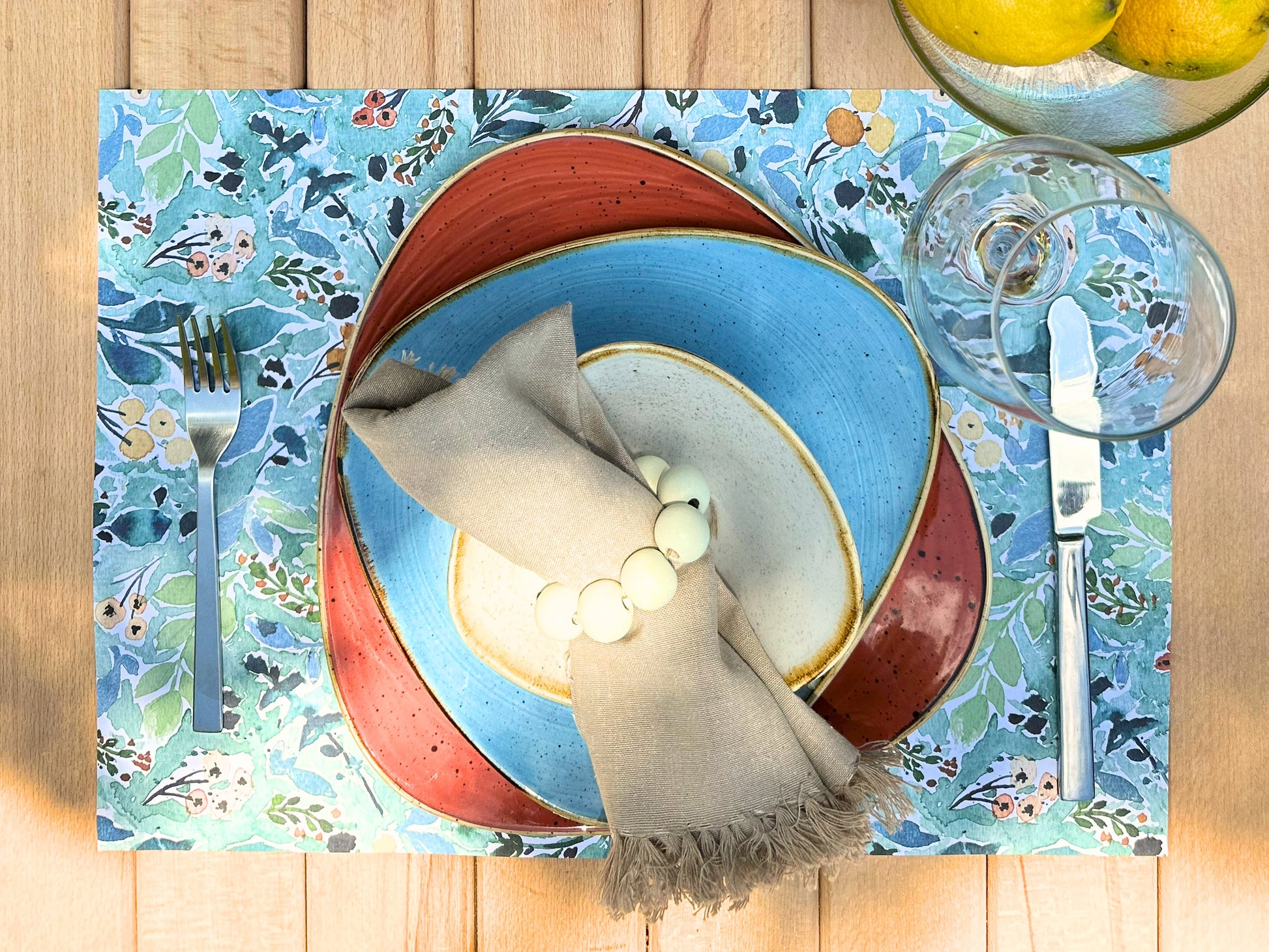 Disposable paper placemats with floral print for dining tables, parties, and outdoor gatherings