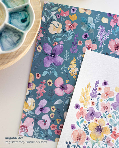 Floral patterned paper and card with watercolor paint palette on a white background