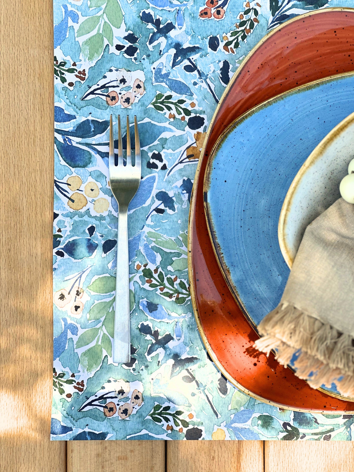Disposable paper placemats with floral print for dining tables, parties, and outdoor gatherings