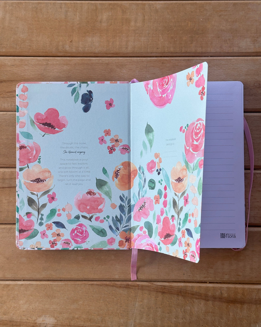 Floral notebook on a wooden surface