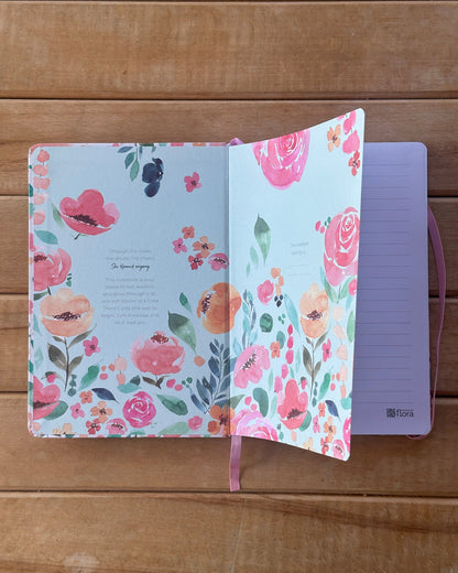 Floral notebook on a wooden surface