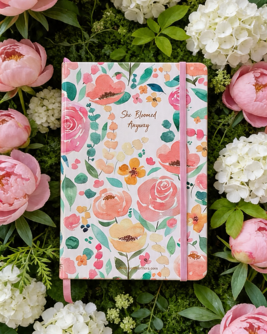 Floral notebook on a bed of pink and white flowers